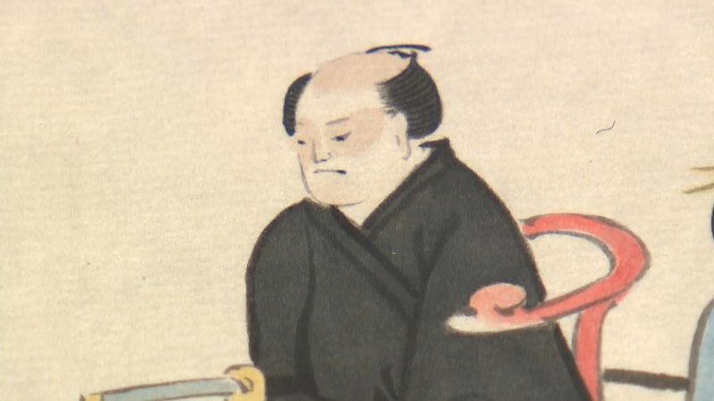 写真を撮られる日本人の絵